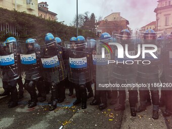 During a student march, a clash occurs in front of the Polytechnic University in Turin, Italy, on December 13, 2024. The students attempt to...