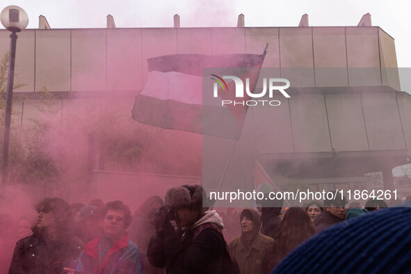 During a student march, a clash occurs in front of the Polytechnic University in Turin, Italy, on December 13, 2024. The students attempt to...