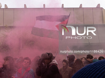 During a student march, a clash occurs in front of the Polytechnic University in Turin, Italy, on December 13, 2024. The students attempt to...