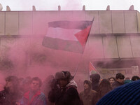 During a student march, a clash occurs in front of the Polytechnic University in Turin, Italy, on December 13, 2024. The students attempt to...