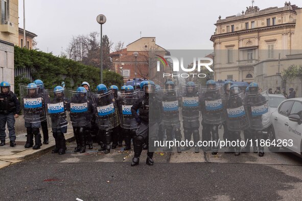 During a student march, a clash occurs in front of the Polytechnic University in Turin, Italy, on December 13, 2024. The students attempt to...