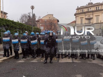 During a student march, a clash occurs in front of the Polytechnic University in Turin, Italy, on December 13, 2024. The students attempt to...