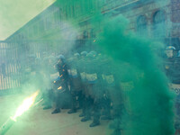 During a student march, a clash occurs in front of the Polytechnic University in Turin, Italy, on December 13, 2024. The students attempt to...