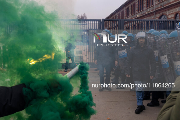 During a student march, a clash occurs in front of the Polytechnic University in Turin, Italy, on December 13, 2024. The students attempt to...