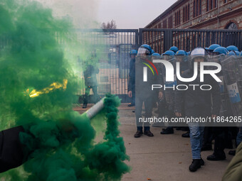 During a student march, a clash occurs in front of the Polytechnic University in Turin, Italy, on December 13, 2024. The students attempt to...