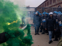 During a student march, a clash occurs in front of the Polytechnic University in Turin, Italy, on December 13, 2024. The students attempt to...