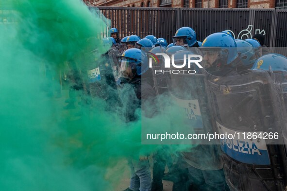 During a student march, a clash occurs in front of the Polytechnic University in Turin, Italy, on December 13, 2024. The students attempt to...