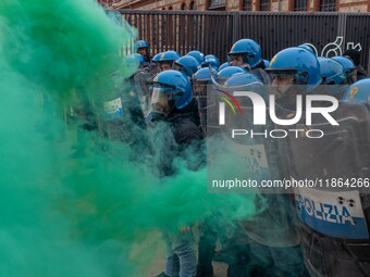 During a student march, a clash occurs in front of the Polytechnic University in Turin, Italy, on December 13, 2024. The students attempt to...