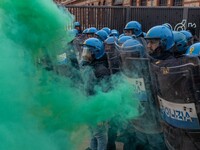 During a student march, a clash occurs in front of the Polytechnic University in Turin, Italy, on December 13, 2024. The students attempt to...