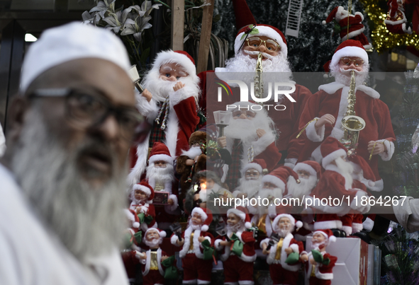 Santa Claus items are seen in a shop at a market ahead of the Christmas celebrations in Mumbai, India, on December 13, 2024. 