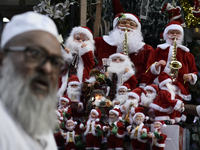 Santa Claus items are seen in a shop at a market ahead of the Christmas celebrations in Mumbai, India, on December 13, 2024. (