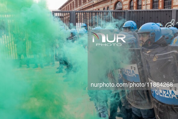 During a student march, a clash occurs in front of the Polytechnic University in Turin, Italy, on December 13, 2024. The students attempt to...