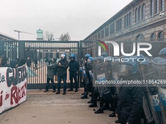 During a student march, a clash occurs in front of the Polytechnic University in Turin, Italy, on December 13, 2024. The students attempt to...