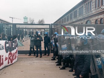 During a student march, a clash occurs in front of the Polytechnic University in Turin, Italy, on December 13, 2024. The students attempt to...