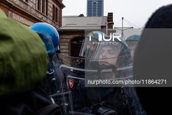 During a student march, a clash occurs in front of the Polytechnic University in Turin, Italy, on December 13, 2024. The students attempt to...