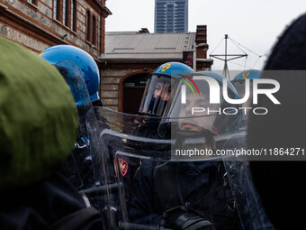 During a student march, a clash occurs in front of the Polytechnic University in Turin, Italy, on December 13, 2024. The students attempt to...