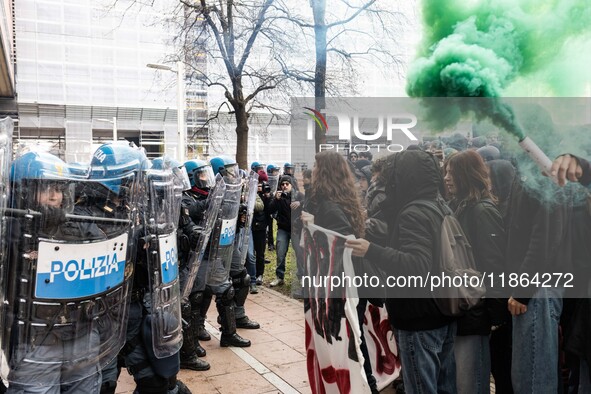 During a student march, a clash occurs in front of the Polytechnic University in Turin, Italy, on December 13, 2024. The students attempt to...