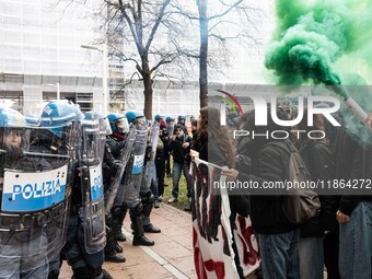 During a student march, a clash occurs in front of the Polytechnic University in Turin, Italy, on December 13, 2024. The students attempt to...