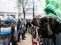 During a student march, a clash occurs in front of the Polytechnic University in Turin, Italy, on December 13, 2024. The students attempt to...