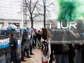 During a student march, a clash occurs in front of the Polytechnic University in Turin, Italy, on December 13, 2024. The students attempt to...