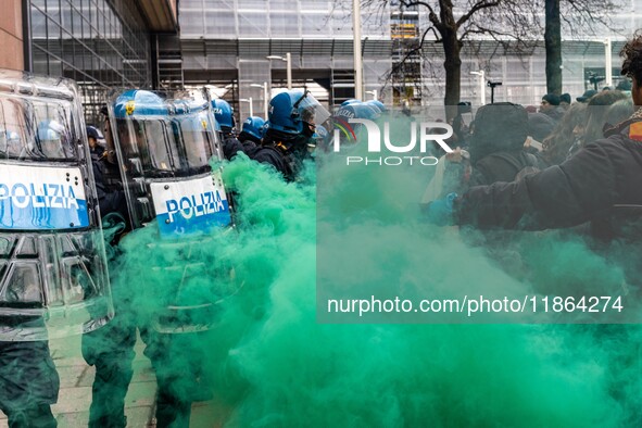 During a student march, a clash occurs in front of the Polytechnic University in Turin, Italy, on December 13, 2024. The students attempt to...