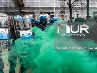 During a student march, a clash occurs in front of the Polytechnic University in Turin, Italy, on December 13, 2024. The students attempt to...