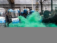 During a student march, a clash occurs in front of the Polytechnic University in Turin, Italy, on December 13, 2024. The students attempt to...