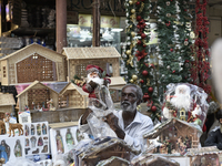 A shopkeeper sells Santa Claus at a market ahead of the Christmas celebrations in Mumbai, India, on December 13, 2024. (