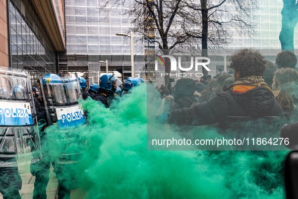 During a student march, a clash occurs in front of the Polytechnic University in Turin, Italy, on December 13, 2024. The students attempt to...