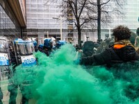 During a student march, a clash occurs in front of the Polytechnic University in Turin, Italy, on December 13, 2024. The students attempt to...