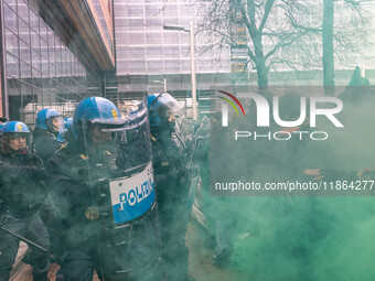 During a student march, a clash occurs in front of the Polytechnic University in Turin, Italy, on December 13, 2024. The students attempt to...