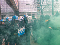 During a student march, a clash occurs in front of the Polytechnic University in Turin, Italy, on December 13, 2024. The students attempt to...