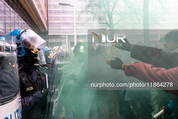 During a student march, a clash occurs in front of the Polytechnic University in Turin, Italy, on December 13, 2024. The students attempt to...