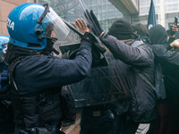 During a student march, a clash occurs in front of the Polytechnic University in Turin, Italy, on December 13, 2024. The students attempt to...