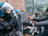 During a student march, a clash occurs in front of the Polytechnic University in Turin, Italy, on December 13, 2024. The students attempt to...