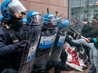 During a student march, a clash occurs in front of the Polytechnic University in Turin, Italy, on December 13, 2024. The students attempt to...