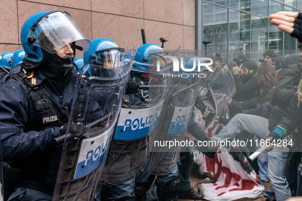 During a student march, a clash occurs in front of the Polytechnic University in Turin, Italy, on December 13, 2024. The students attempt to...