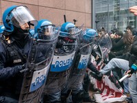 During a student march, a clash occurs in front of the Polytechnic University in Turin, Italy, on December 13, 2024. The students attempt to...