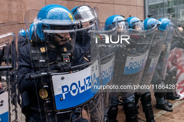 During a student march, a clash occurs in front of the Polytechnic University in Turin, Italy, on December 13, 2024. The students attempt to...