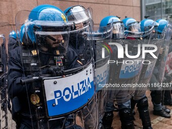 During a student march, a clash occurs in front of the Polytechnic University in Turin, Italy, on December 13, 2024. The students attempt to...