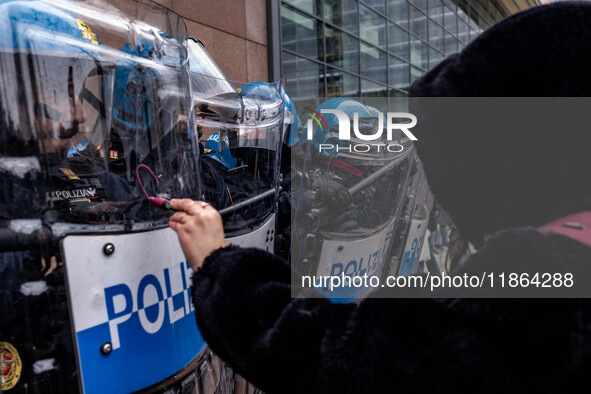 During a student march, a clash occurs in front of the Polytechnic University in Turin, Italy, on December 13, 2024. The students attempt to...