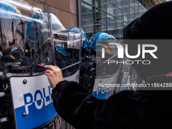 During a student march, a clash occurs in front of the Polytechnic University in Turin, Italy, on December 13, 2024. The students attempt to...