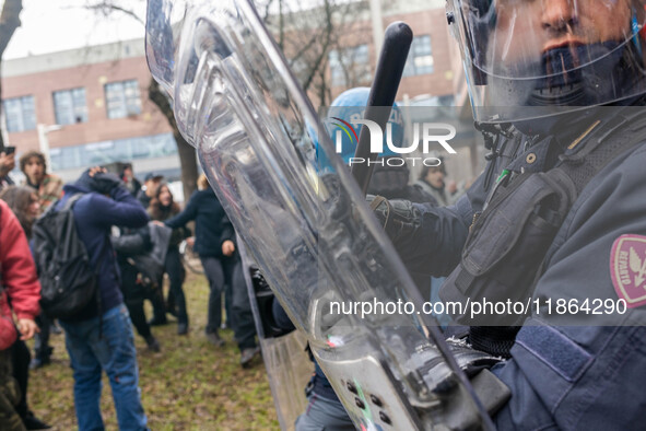 During a student march, a clash occurs in front of the Polytechnic University in Turin, Italy, on December 13, 2024. The students attempt to...