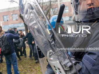 During a student march, a clash occurs in front of the Polytechnic University in Turin, Italy, on December 13, 2024. The students attempt to...