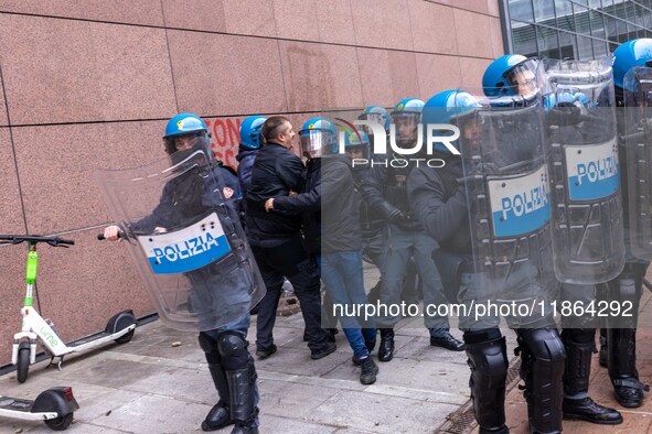 During a student march, a clash occurs in front of the Polytechnic University in Turin, Italy, on December 13, 2024. The students attempt to...