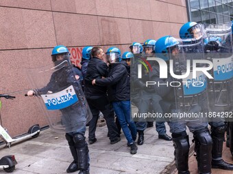 During a student march, a clash occurs in front of the Polytechnic University in Turin, Italy, on December 13, 2024. The students attempt to...