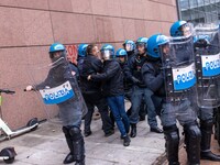 During a student march, a clash occurs in front of the Polytechnic University in Turin, Italy, on December 13, 2024. The students attempt to...