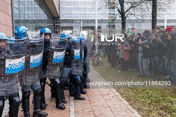 During a student march, a clash occurs in front of the Polytechnic University in Turin, Italy, on December 13, 2024. The students attempt to...