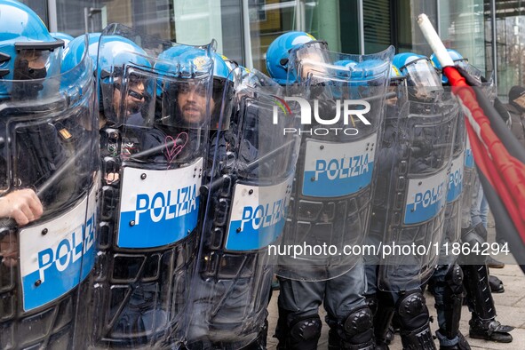 During a student march, a clash occurs in front of the Polytechnic University in Turin, Italy, on December 13, 2024. The students attempt to...