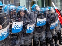 During a student march, a clash occurs in front of the Polytechnic University in Turin, Italy, on December 13, 2024. The students attempt to...